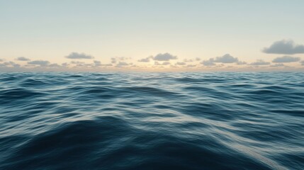 Obraz premium Serene Ocean Waves Under a Cloudy Sunset Sky