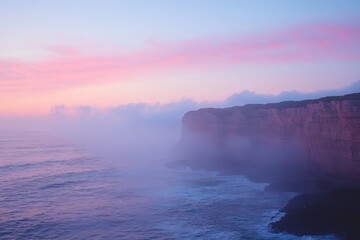 Obraz premium Coastal cliffs and ocean waves under pink and orange sunset skies