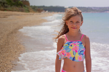 Portrait of beautiful girl of 7-8 years looking at camera