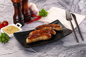 Delicous natural roasted sausages in the plate