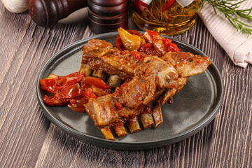 Baked lamb ribs with vegetables