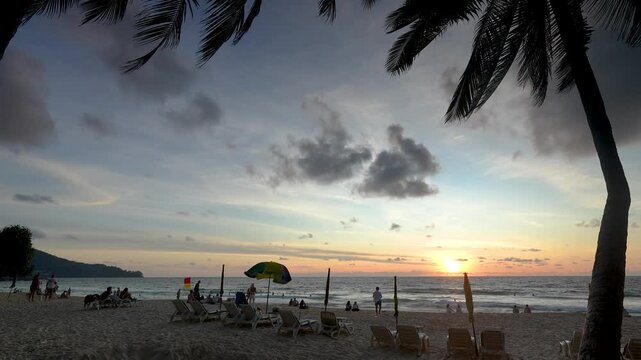 Tropical beach on south side of lsland with coconut palm trees.