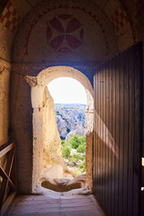 Fototapeta premium An ancient Byzantine cave city in Cappadocia. Murals in a cave Christian church. Goreme, Turkey