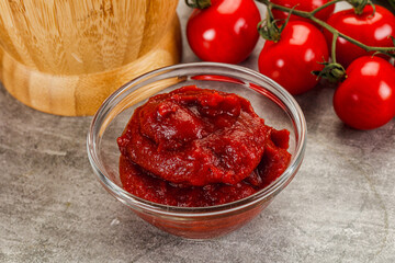 Red tomato paste in the bowl