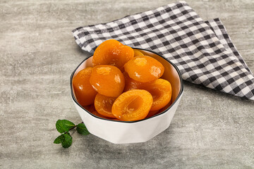 Sweet canned apricots with syrope
