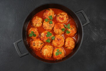 Le boulet with tomato sauce. Beef and pork meatballs in tomato sauce on a plate