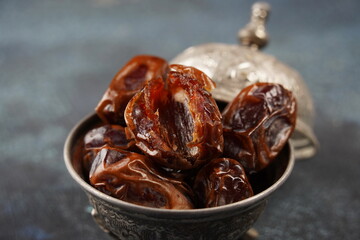 Dates fruit in bowl. Dried organic Superfood.