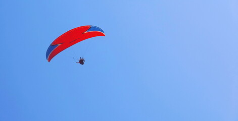 Paraglider Vibrant Aerial Wide Bright Blue Sky Red Canopy