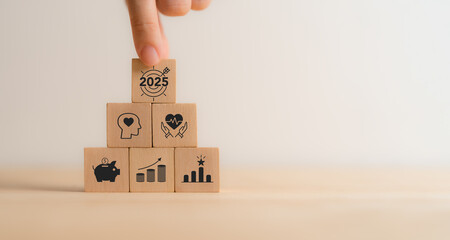 Personal goals, New year's resolutions  in 2025 concept. Wooden blocks with personal goal icons....