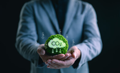 Businessman hands showing with carbon reduction for decrease CO2, carbon footprint and carbon...