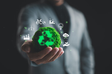 Businessman show globe with Recycling icon, Sustainable Development Concept, surrounded by various...