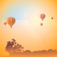 Obraz premium Hot Air Balloons Soar Above a Golden Sunset Landscape