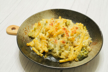 Gratin (doria) made with vegetables, macaroni, cheese and rice. Looks warm and delicious