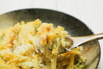 Gratin (doria) made with vegetables, macaroni, cheese and rice. Looks warm and delicious