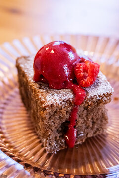 Carob "gat&oacute;" with raspberry sorbet (Mallorcan dessert), "Vida Meva" author restaurant, Mallorca, Balearic Islands, Spain