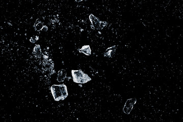 Ice, crushed on a black background. Shards of crushed ice.