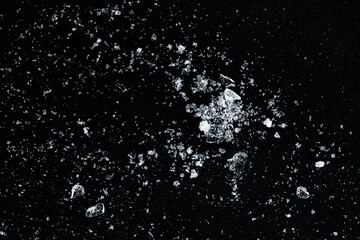 A shards of crushed ice on a black background.