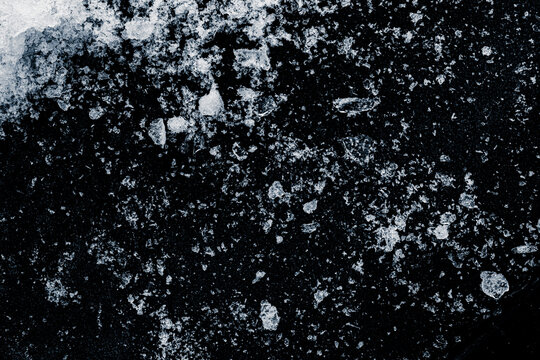 A shards of crushed ice on a black background.