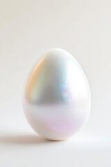 Shimmering egg with pearlescent finish symbolizes renewal and ce