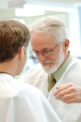 Obraz premium Experienced barber discussing hairstyle options with client in modern salon setting