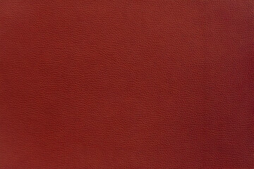 Close-up of Dark Red Leather Texture Shows Detailed Grain and Rich Color for Background or Design Element