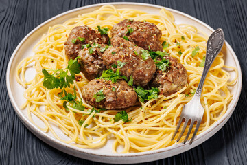 pork burger steak with spaghetti on a plate