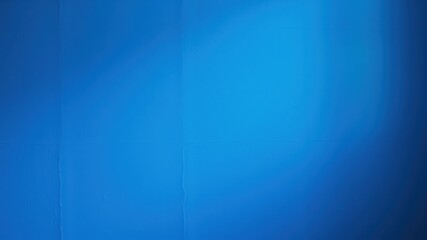 A Seamless Solid Blue Wall Background With Subtle Gradient And Minor Imperfections