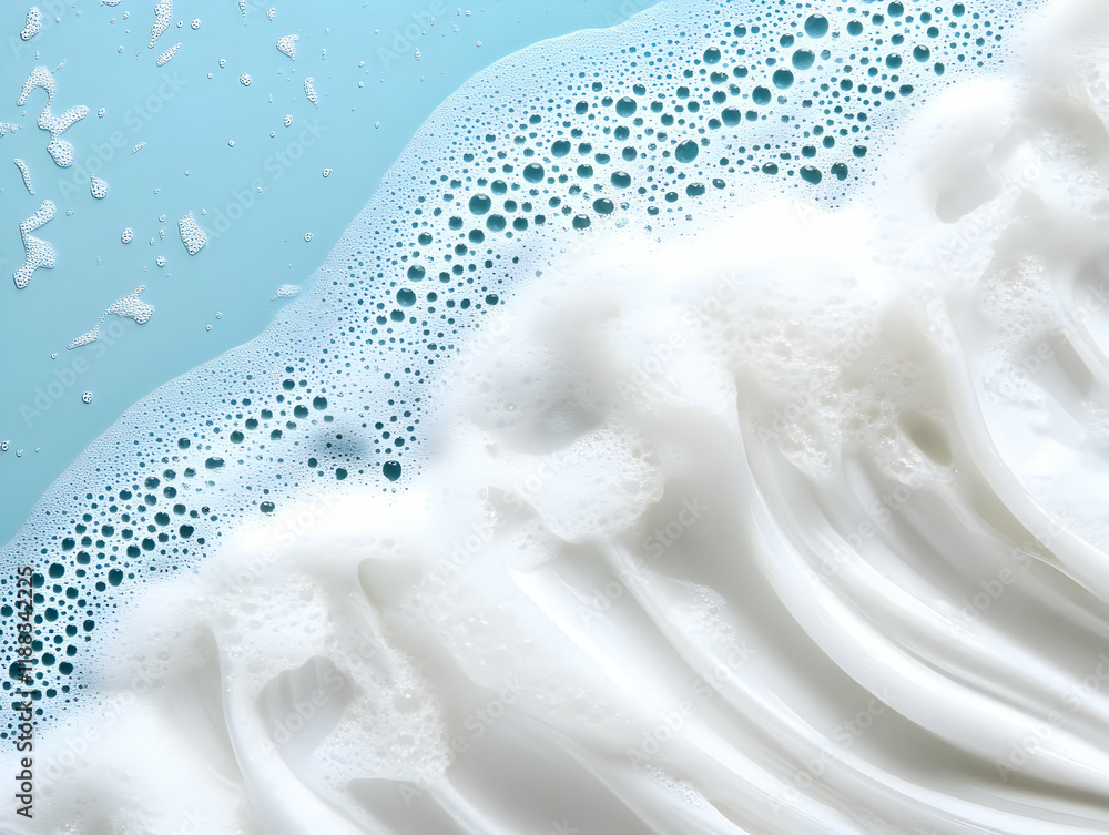 Poster white creamy foam with bubbles flows gently on a light blue surface creating soft waves