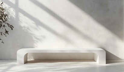 Minimalist white bench against a textured wall with sunlight.