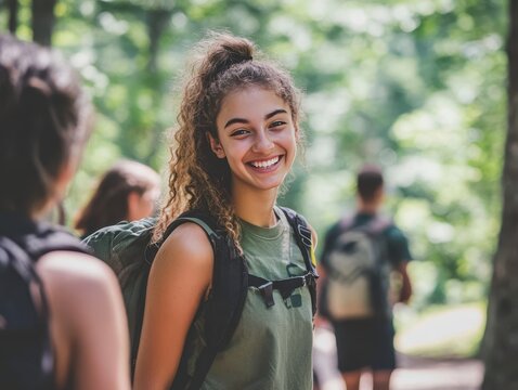 Enthusiastic teenage campers participate in dynamic summer camp activities while experienced counselors guide outdoor sports training sessions during sunny morning recreation program - Powered by Adobe