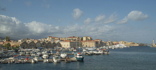 Fototapeta premium Coastline of old town Chania with port, lighthouse and fortress venetian Firka in Crete, Greece
