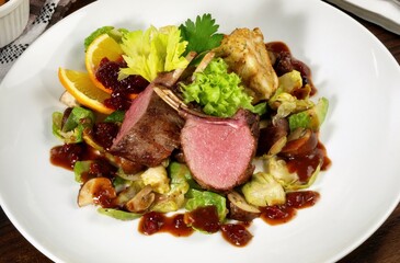 Fallow Deer with Vegetables on Cranberry Sauce