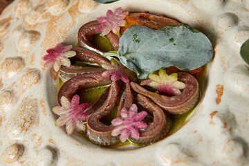 Horse mackerel fillet with radish and spinach in sauce