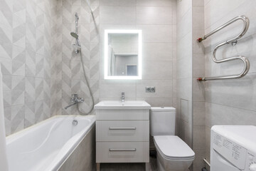 modern bathroom room with toilet and washing machine