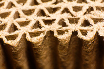extreme close up of corrugated cardboard. corrugated cardboard for packing. abstract background horizontal lines with wavy lines of beige color
