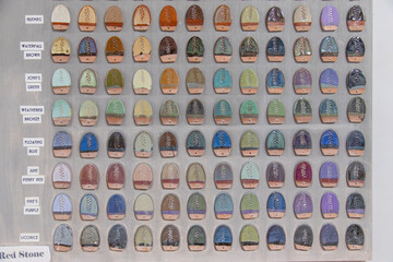 Close-up full frame of a wall chart showing different types of pottery glazing