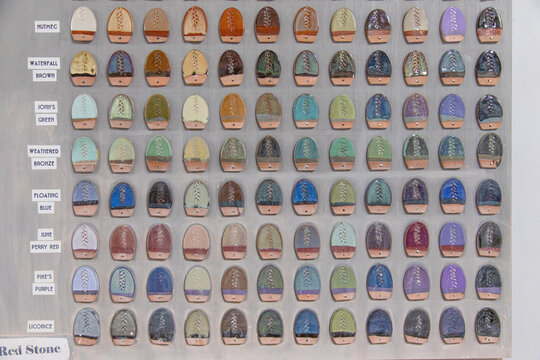 Close-up full frame of a wall chart showing different types of pottery glazing