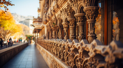 Fototapeta premium Intricate architectural details of a historic building along a tree-lined walkway during autumn
