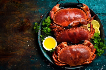 Seafood. Steaming boiled crab. On a stone background. Top view. Close-up.