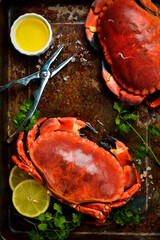 Seafood. Boiled crabs seasoned with lemon, salt and spices. Vertical photo, top view.