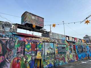 Bahnwärter Thiel in Munich During Winter with Snow-Dusted Containers and Decommissioned Subway Cars