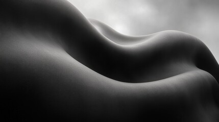 Naklejka premium A black and white photo of a woman's body in the sand