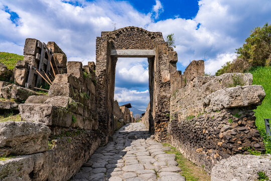 Pompei, Italy - 22 march 2024 - Tourist wandering at the Pompei ground visiting the ancient Roman city at the Nuceria Gate