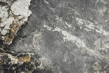 Fototapeta premium Smooth grey desk texture against a white limestone wall featuring a flat stone tabletop and a calm grunge gray floor