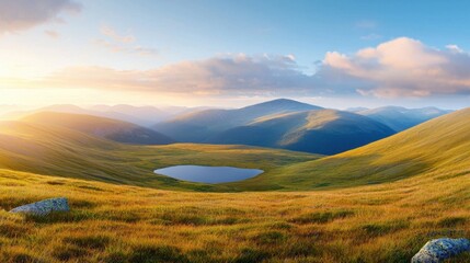 Fototapeta premium A grassy field with a small lake in the middle of it
