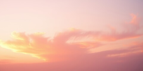 Obraz premium Pastel Pink and Orange Sky with Wispy Clouds at Sunset