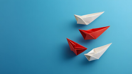 Group of white paper ships all moving in one direction, with one red paper ship going the opposite way, symbolizing innovative solutions