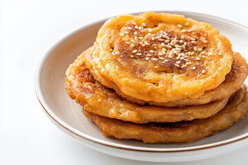 Yakgwa a traditional South Korean pancake made with honey and sesame oil is set against a white background and is a popular snack for tourists
