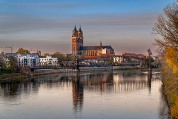 beautiful Magdeburg city panorama, November 22, 2022, Germany, Saxony-Anhalt in winter evening light with the famous Magdeburg Cathedral, Elbe river and the old lift bridge, blue hour cityscape