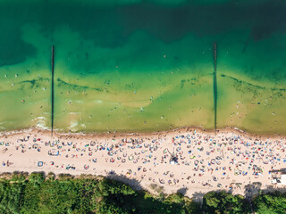 Crowded beach at Baltic Sea in summer, aerial view
